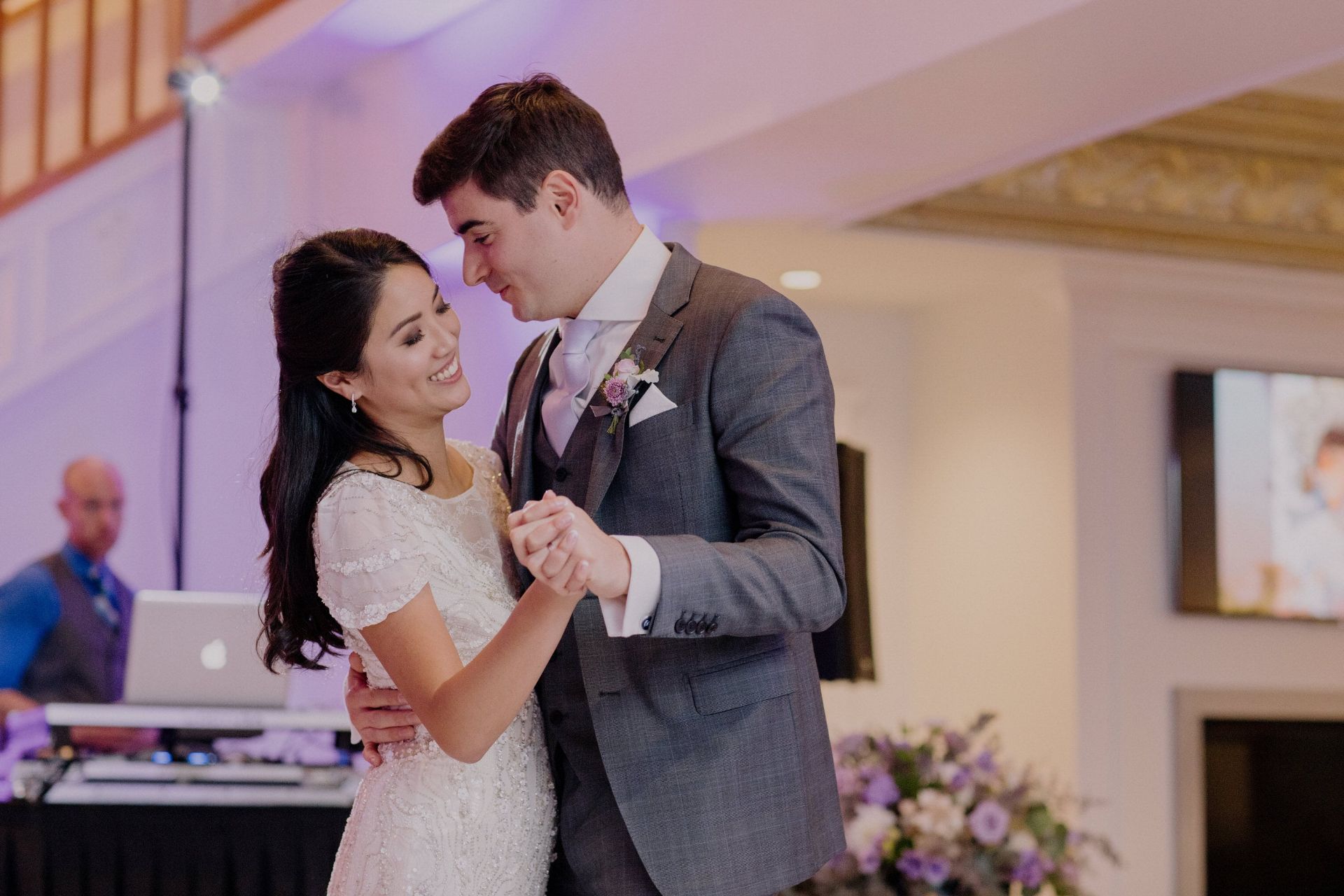 bride and groom with dj cutt in the background