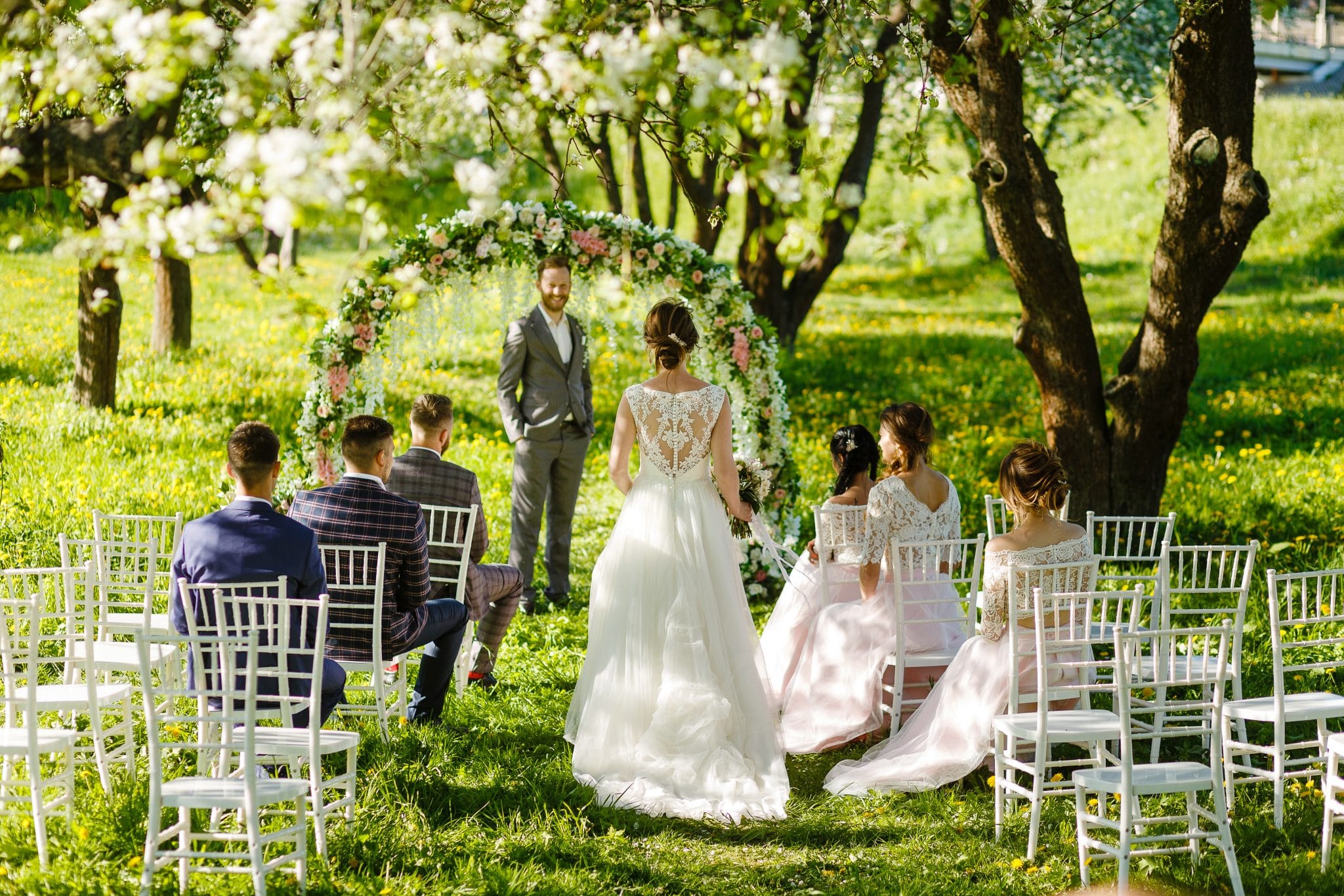 walking down the aisle in a small outdoor wedding 
