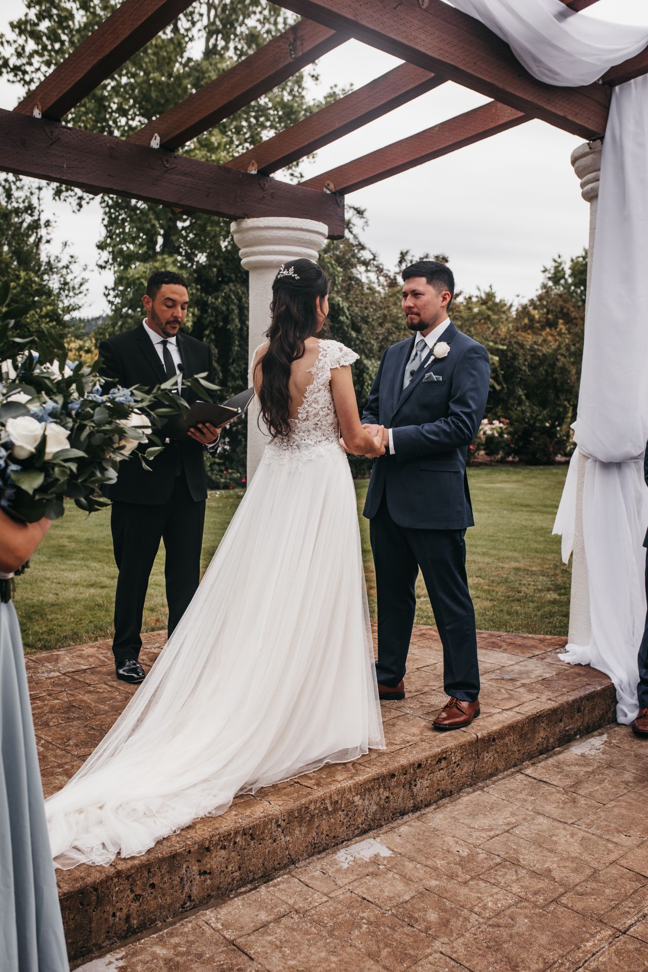 officiant reading from a bible at a wedding 