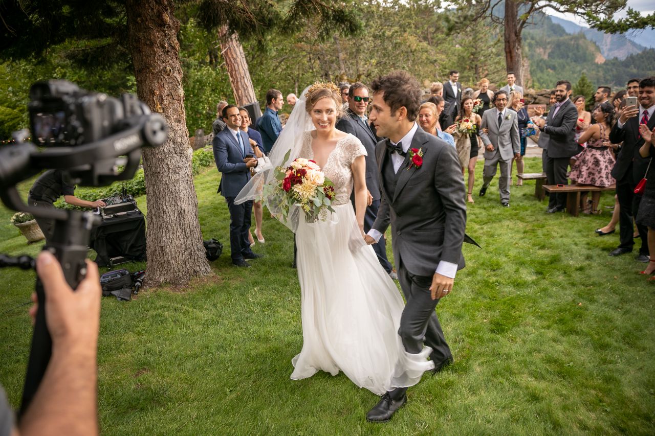 bride and groom walking at a wedding ceremony 