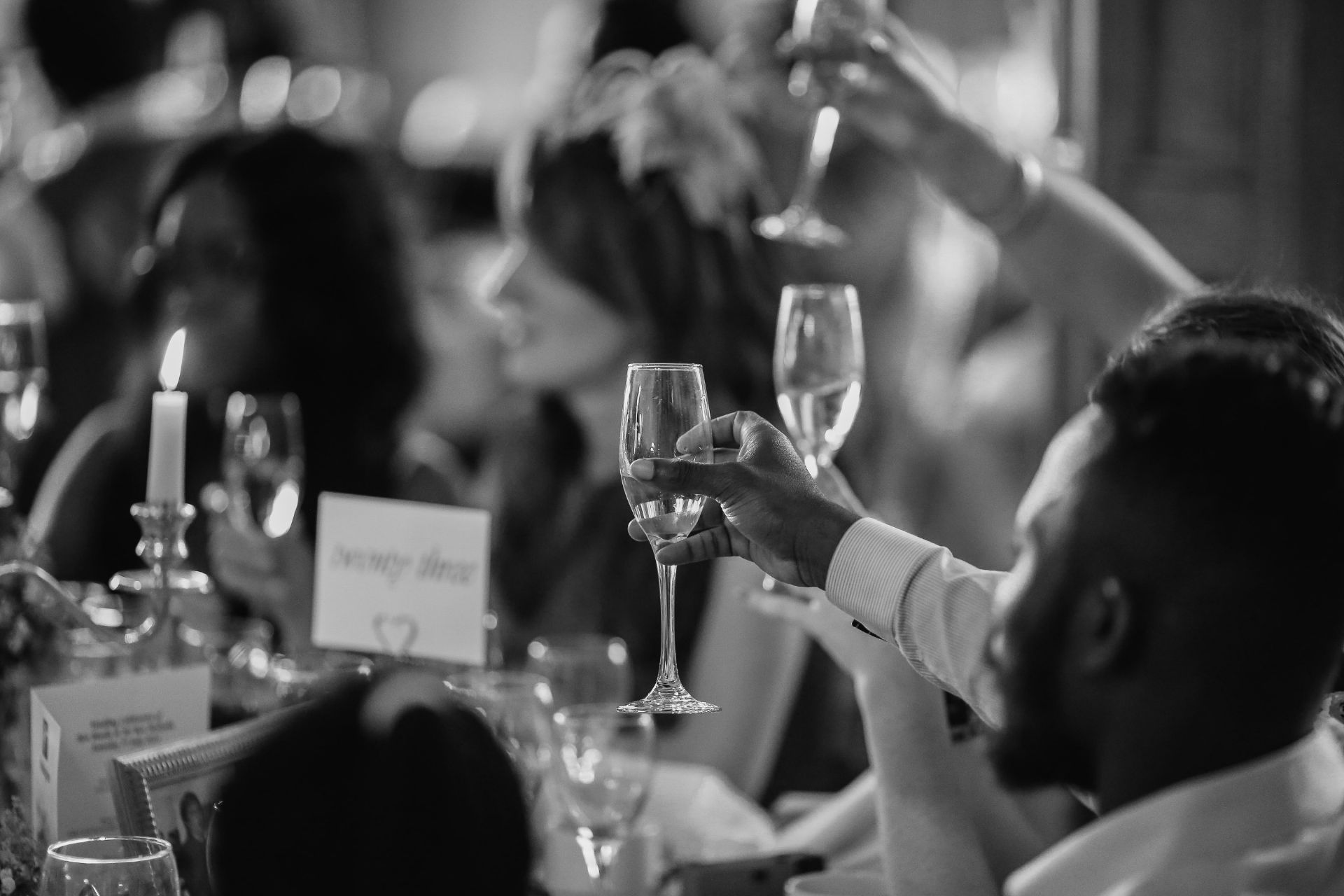 champagne raising a toast at a wedding