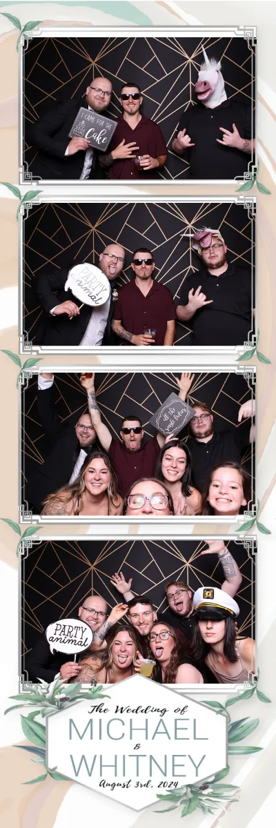 A group of people posing for a picture at a wedding.