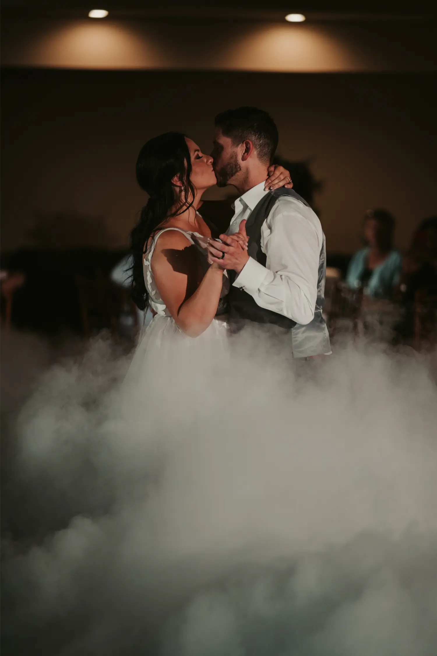 A couple dancing in the fog.