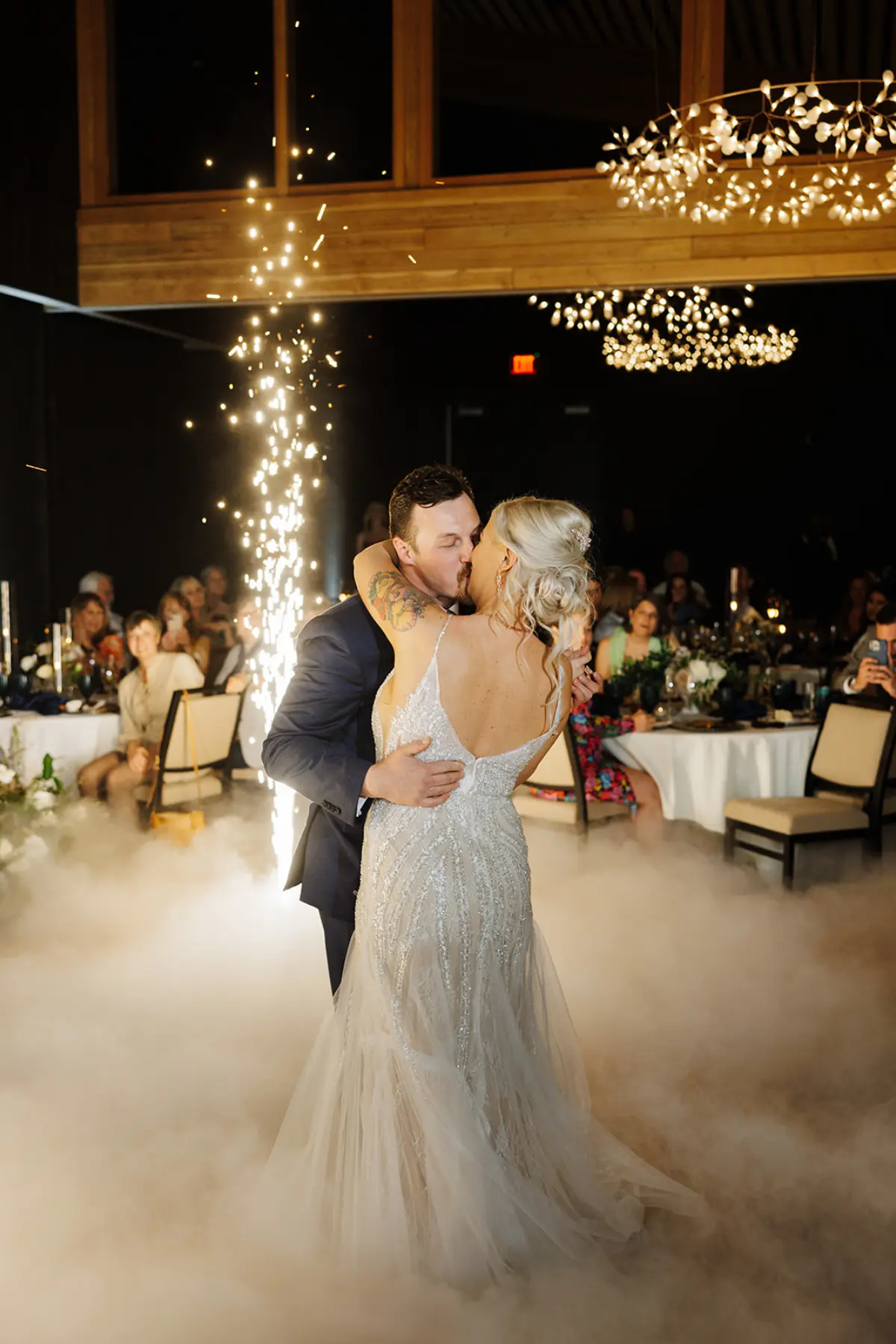 Romantic wedding first dance with sparkling lights and dramatic smoke effect