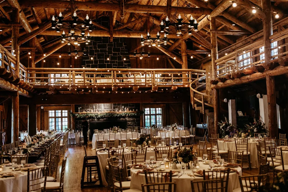 Rustic wooden barn wedding venue with elegant tables and string lights