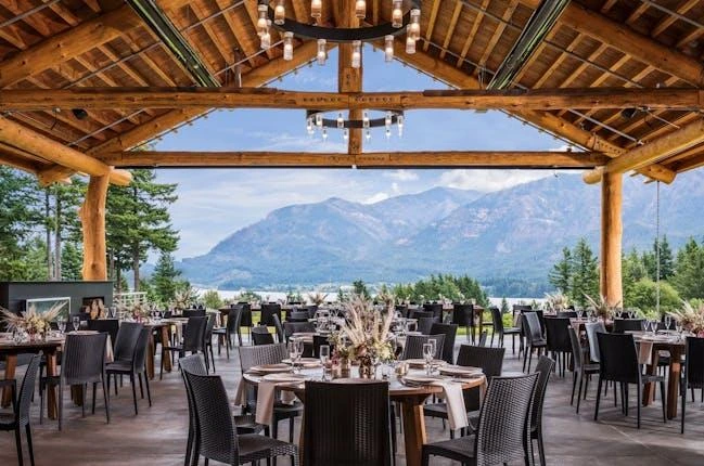 camping weekend wedding venue near Portland Oregon surrounded by Pacific Northwest forest with string lights and outdoor ceremony setup