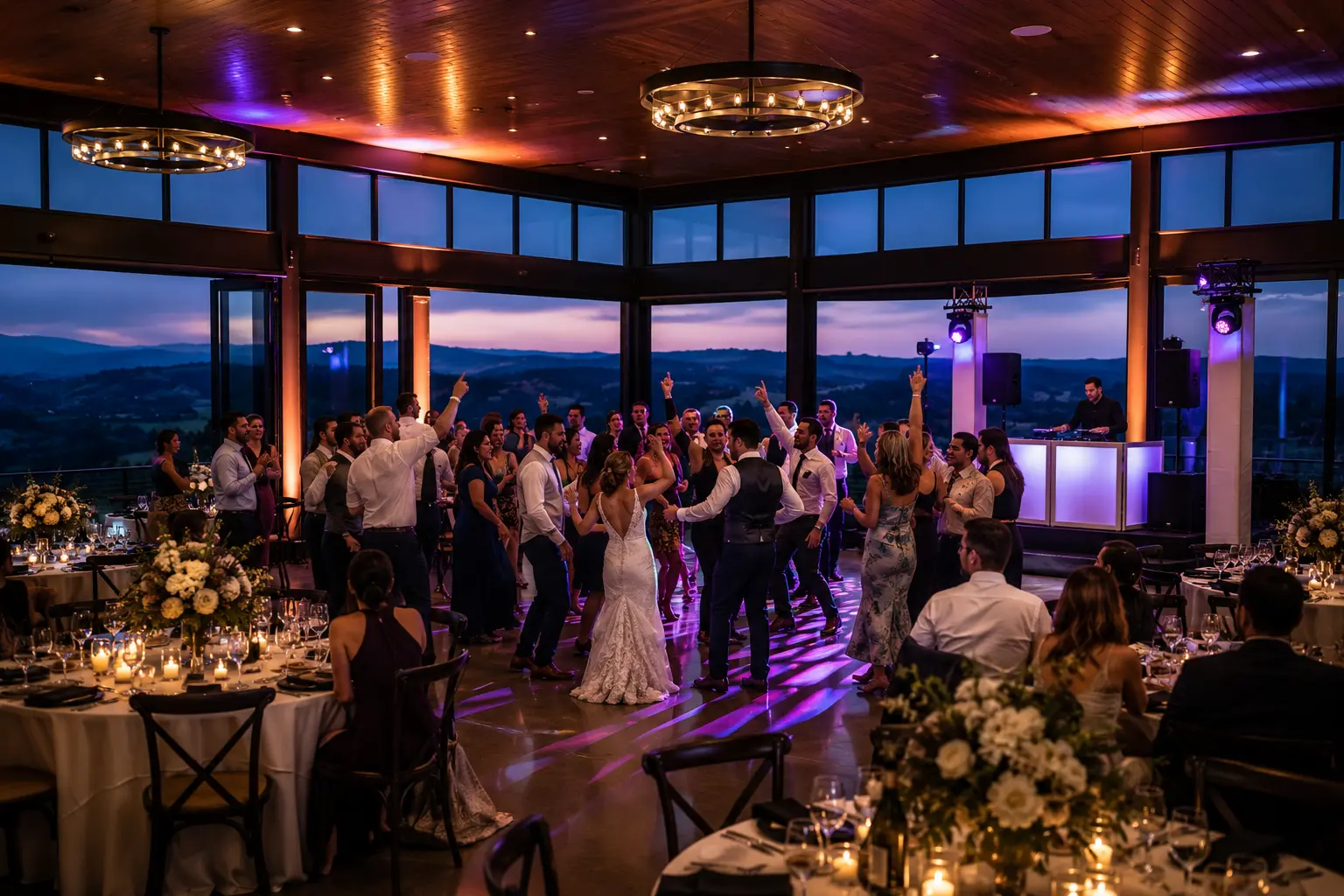 Amaterra Winery Skyline Ballroom wedding reception at evening with warm event lighting dynamic dance floor and hillside wine country views