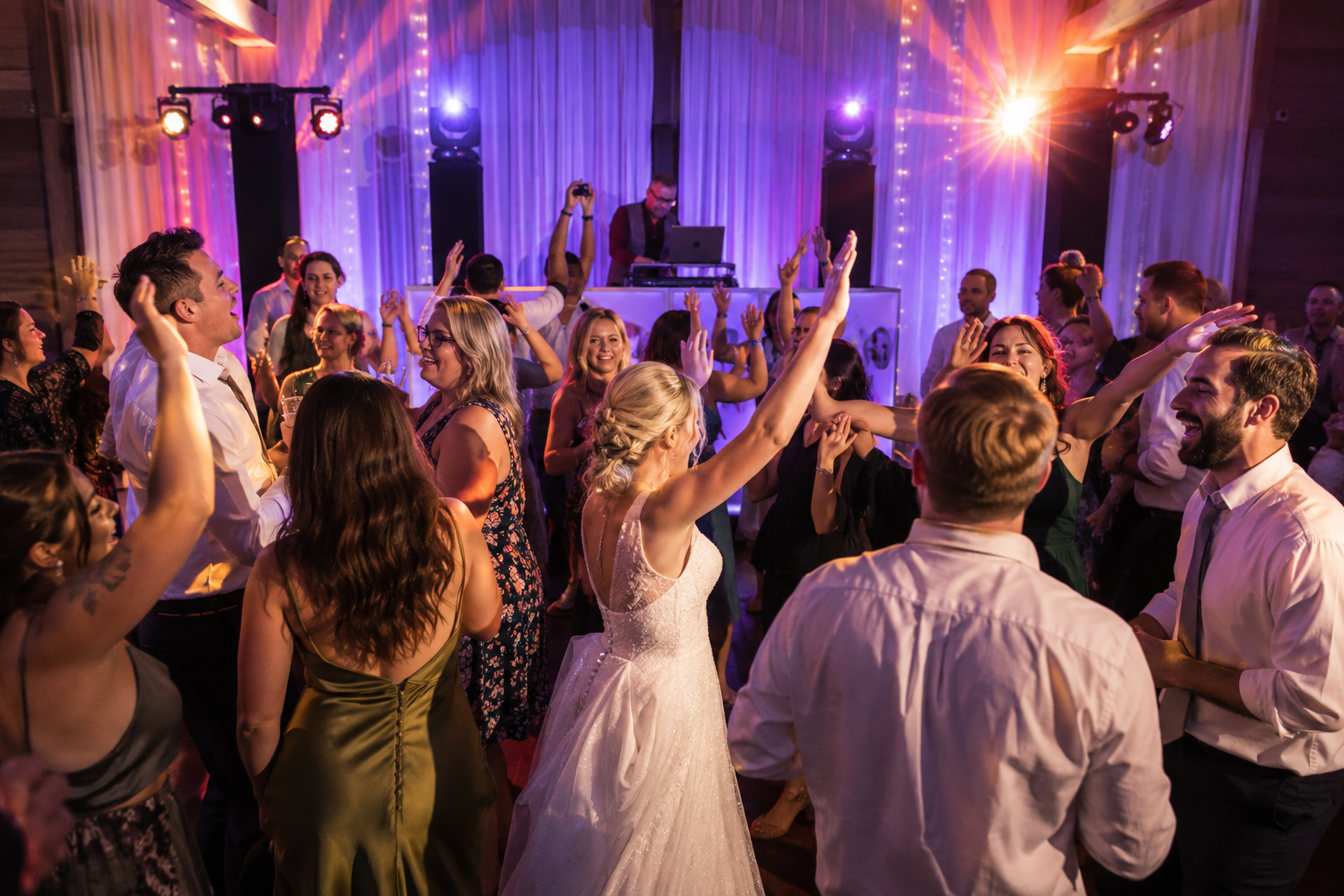  wedding reception dance floor with professional DJ entertainment event lighting and guests dancing at Oregon wedding celebration 