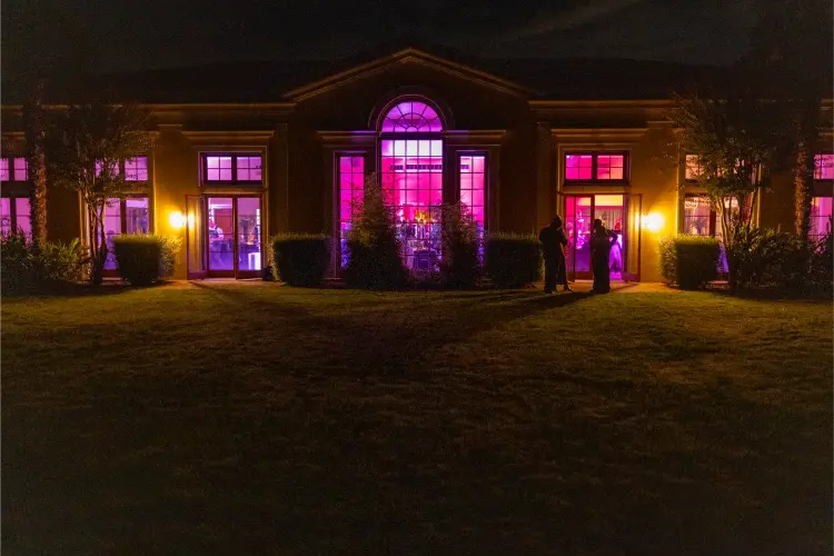 Del Mar Villa illuminated at night during a wedding reception, showcasing elegant event lighting at one of the top wedding venues in Portland Oregon.