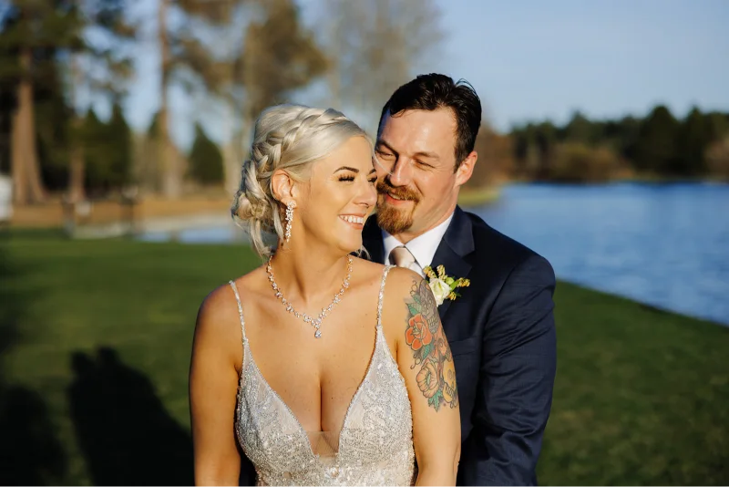 Bride and groom sharing a romantic lakeside portrait during a Black Butte Ranch wedding in Central Oregon.