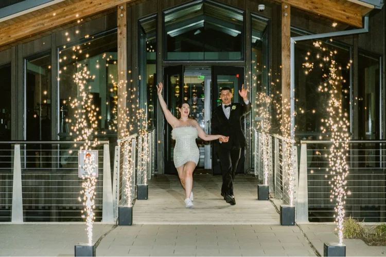 Bride and groom making their grand exit with sparklers during an Amaterra Winery wedding reception in Portland, Oregon.