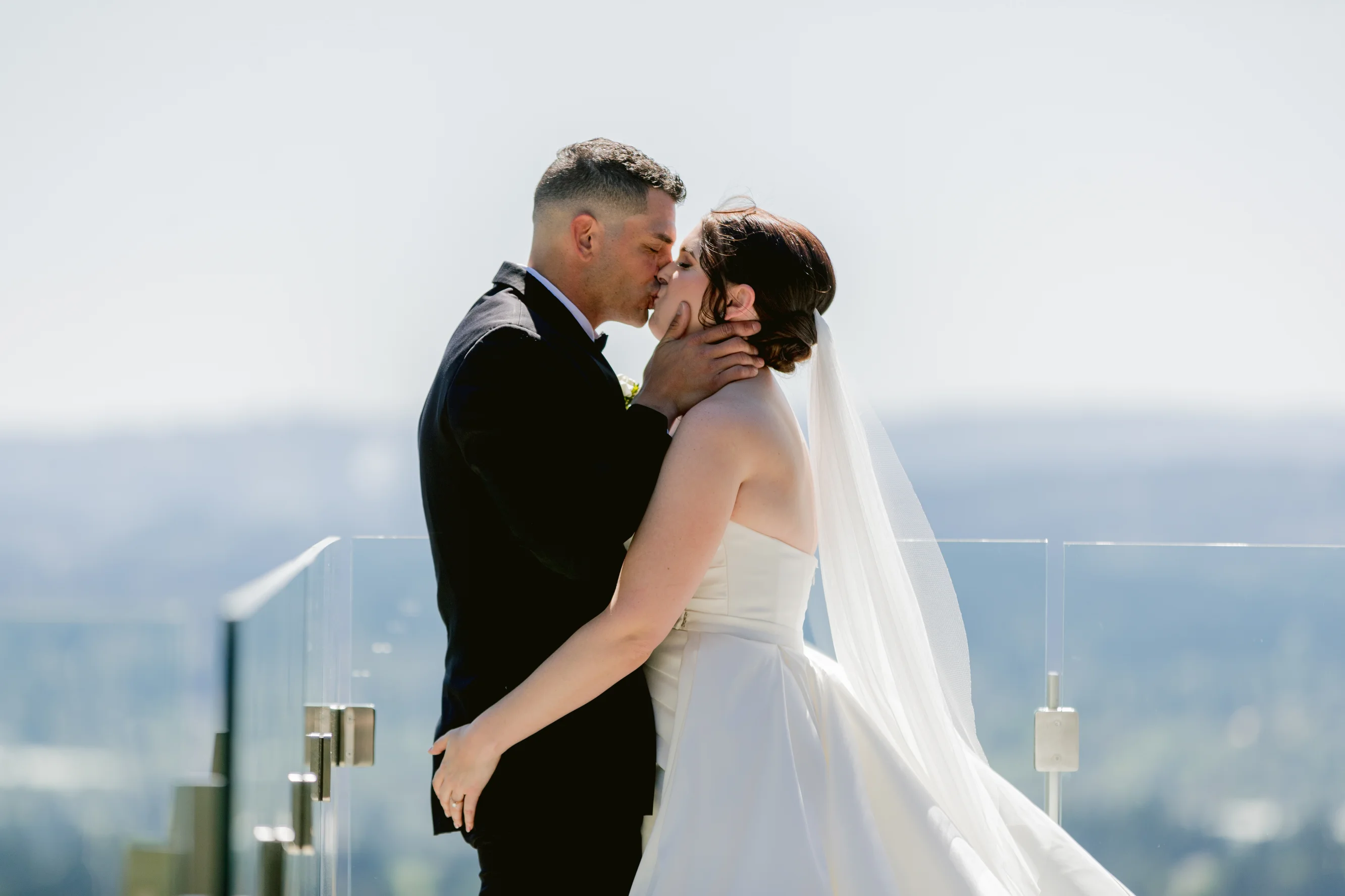 Bride and groom sharing a romantic kiss during an Amaterra Winery wedding portrait session in Portland, Oregon.