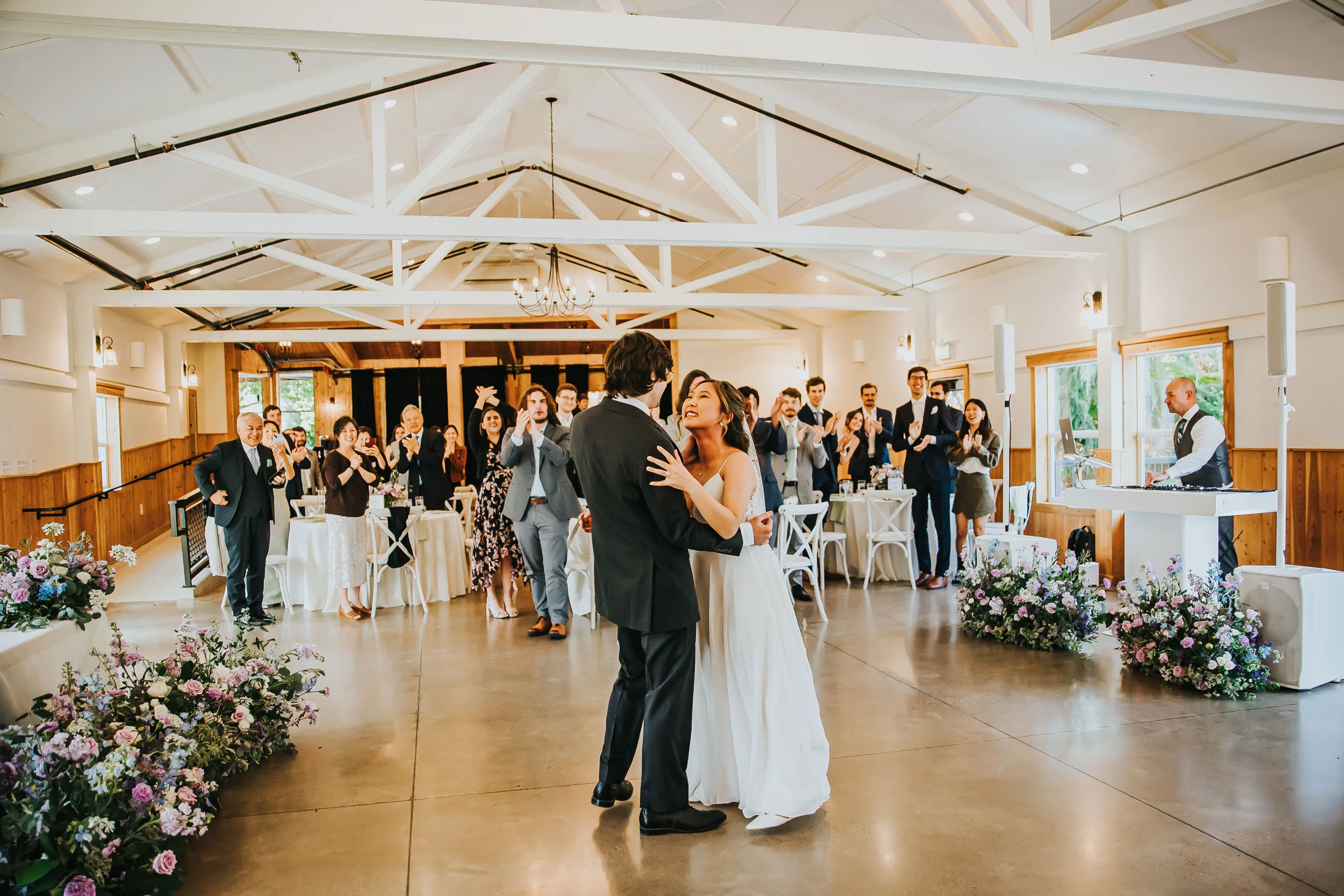 Bride and groom sharing their first dance during an Aurora Vineyards wedding reception in Oregon.