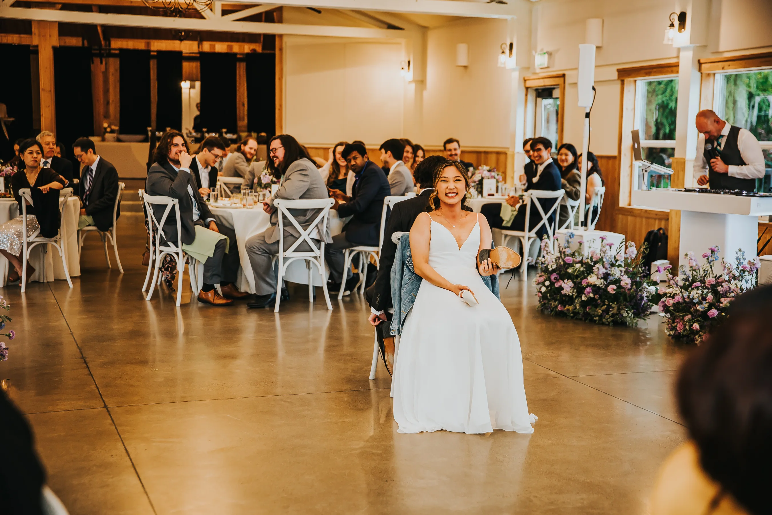 Bride participating in a fun wedding reception game during an Aurora Vineyards wedding in Oregon.