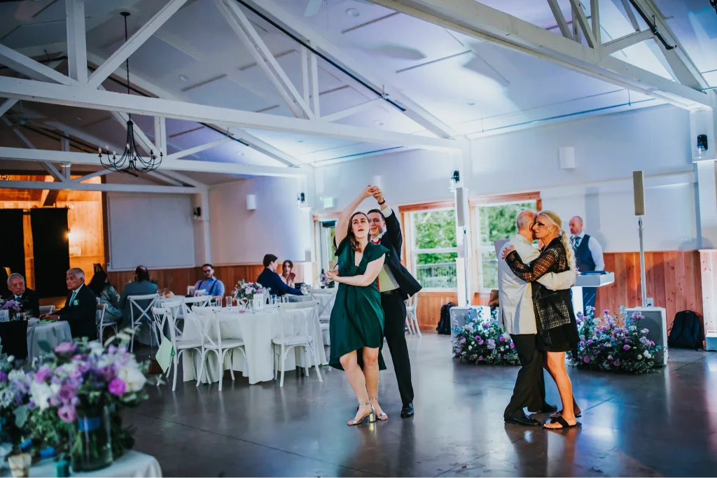 Wedding guests dancing during the reception at an Aurora Vineyards wedding venue in Oregon.