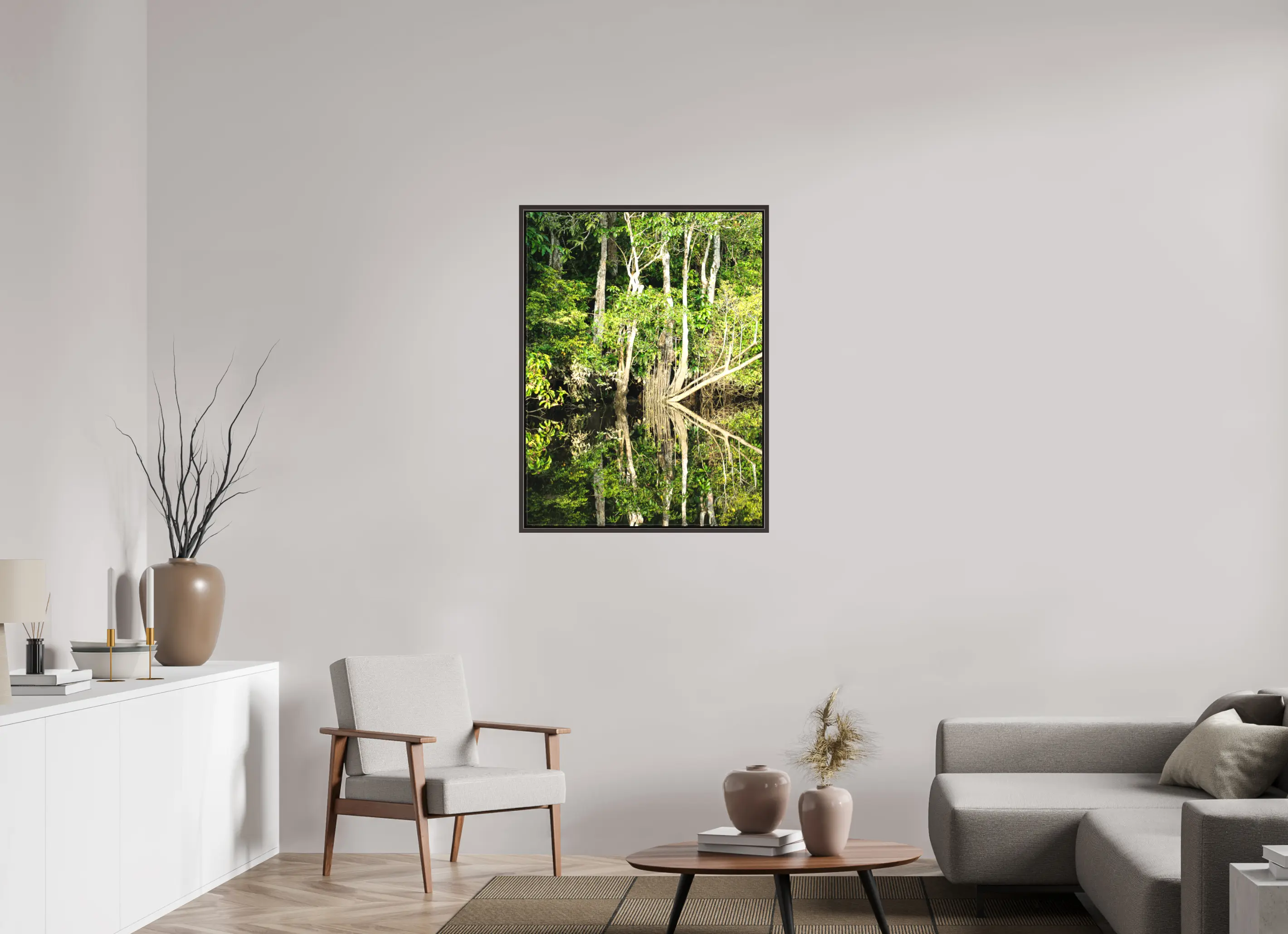 Fine art print “The Jungle Mirror” featuring dense Bornean rainforest trees perfectly reflected in still dark river water, displayed on a premium framed canvas print in a modern living room setting.