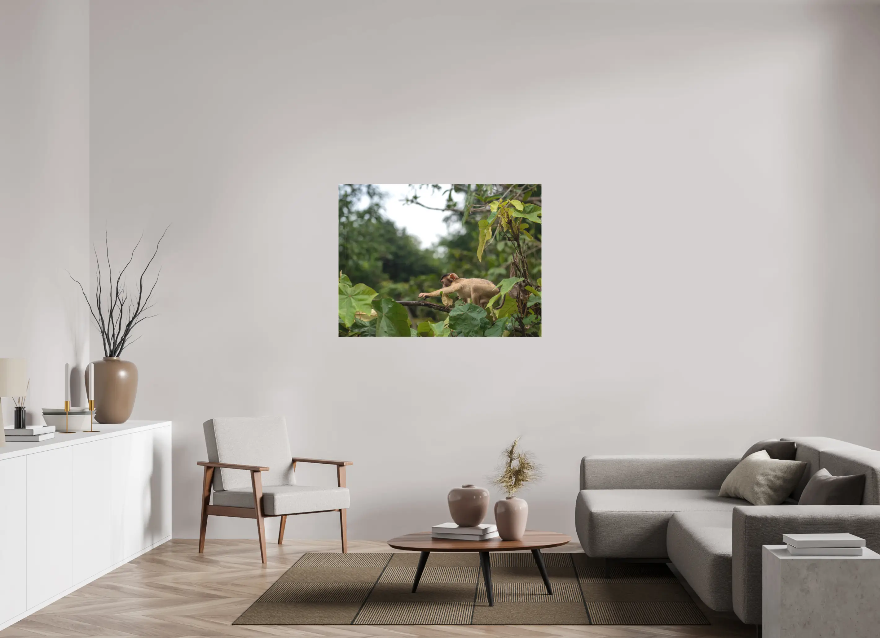 Fine art print “The Reach” featuring a young macaque in the rainforests of Borneo, displayed on a premium canvas print in a modern living room setting.