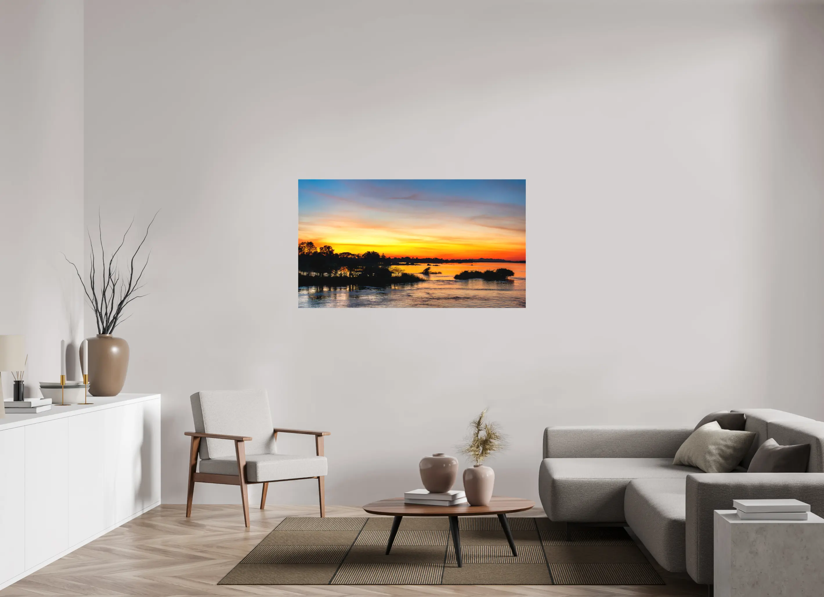 Fine art print “Fire Over the Mekong” featuring a fiery sunset with reflections of orange and gold over the Mekong River in Laos, displayed on a premium canvas print in a modern living room setting.