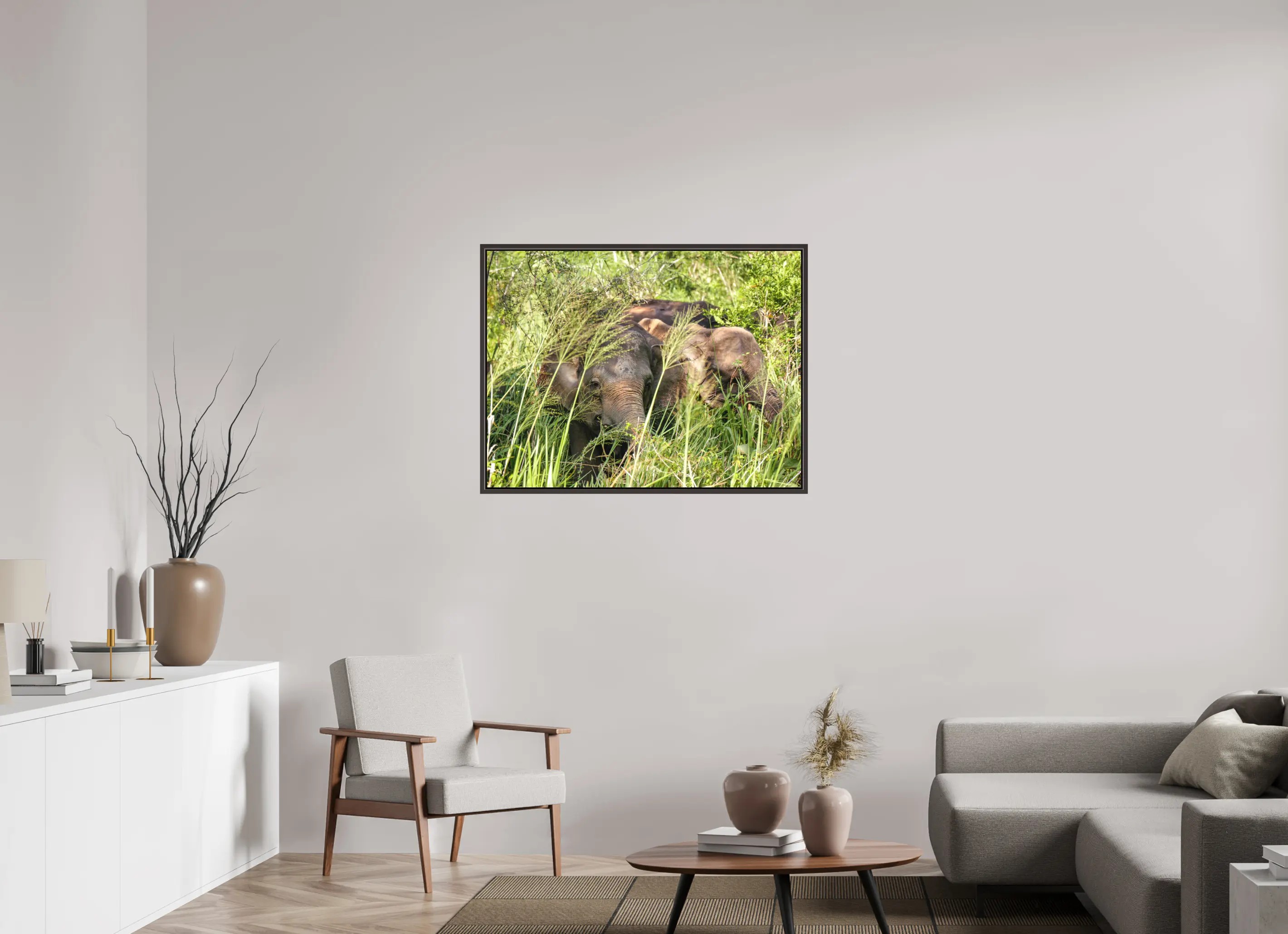 Fine art print “Gentle Giants” featuring wild asian elephants in the forests of Sri Lanka, displayed on a premium framed canvas print in a modern living room setting.
