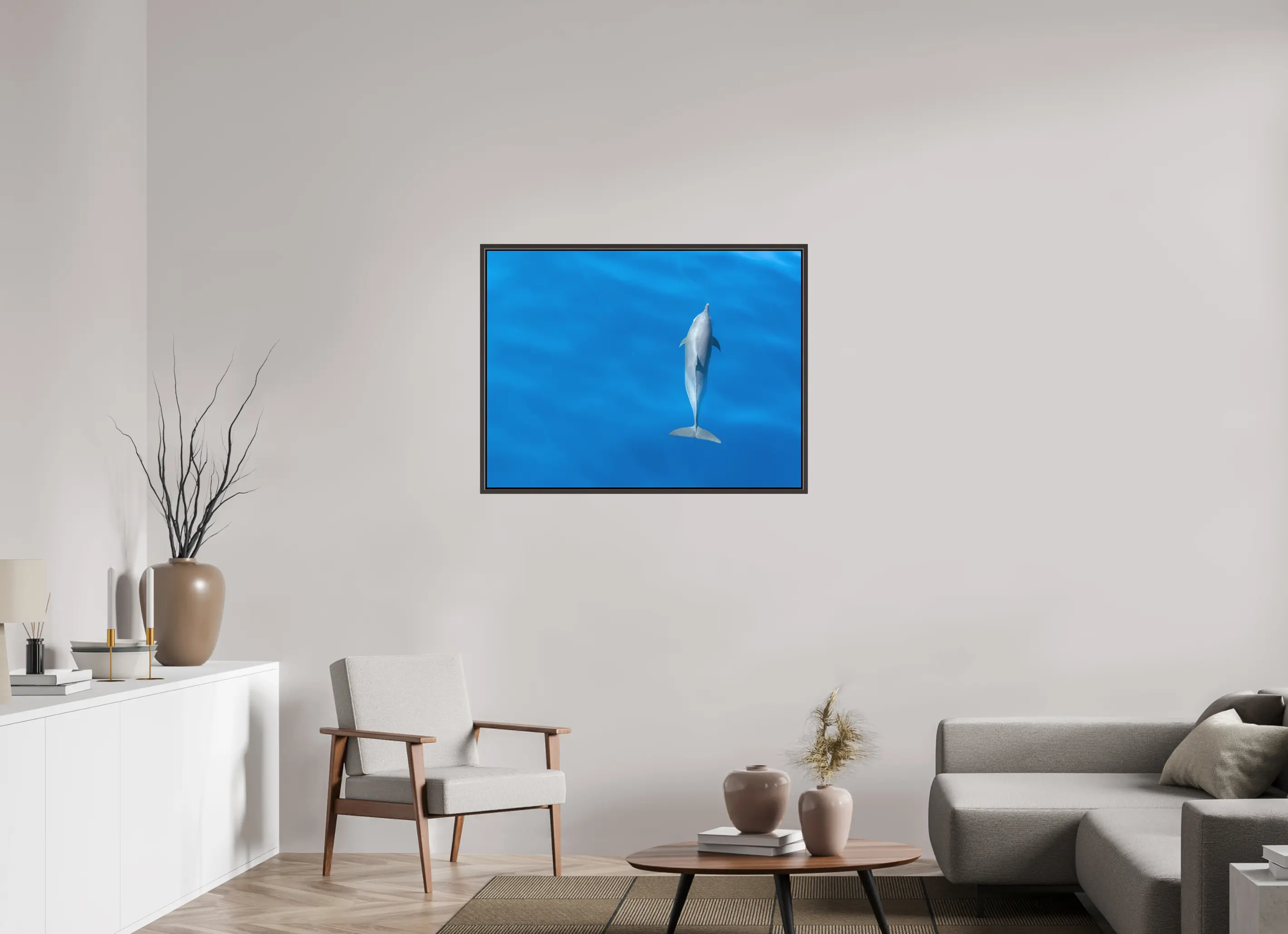 Fine art print “Grace in Blue” featuring a spinner dolphin gliding gracefully through the deep blue waters off the coast of Sri Lanka, displayed on a premium framed canvas print in a modern living room setting.