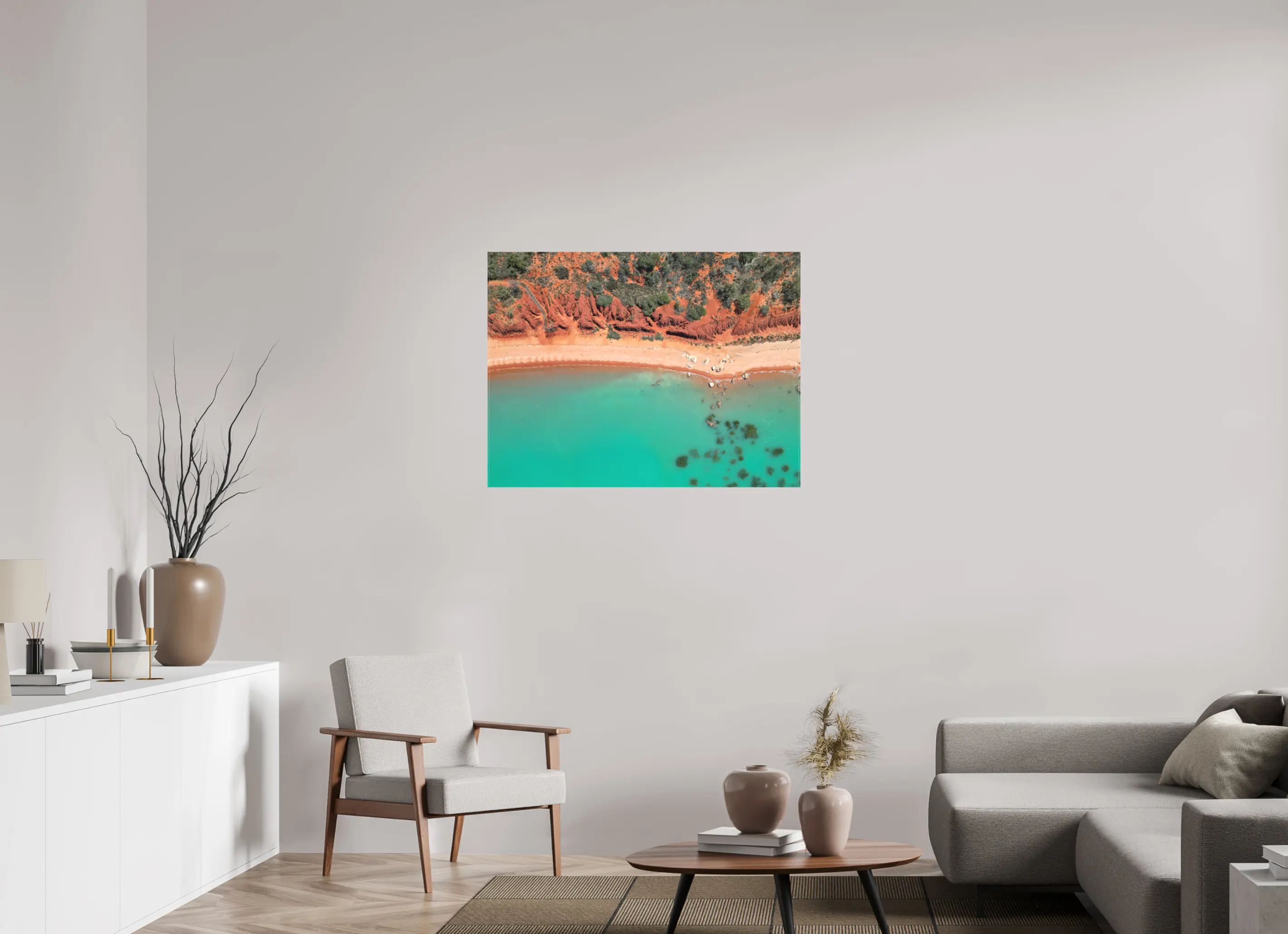 Fine art print “Painted by Nature” featuring an aerial view of red cliffs and turquoise waters meeting along the coast of Broome Western Australia, displayed on a premium canvas print in a modern living room setting.