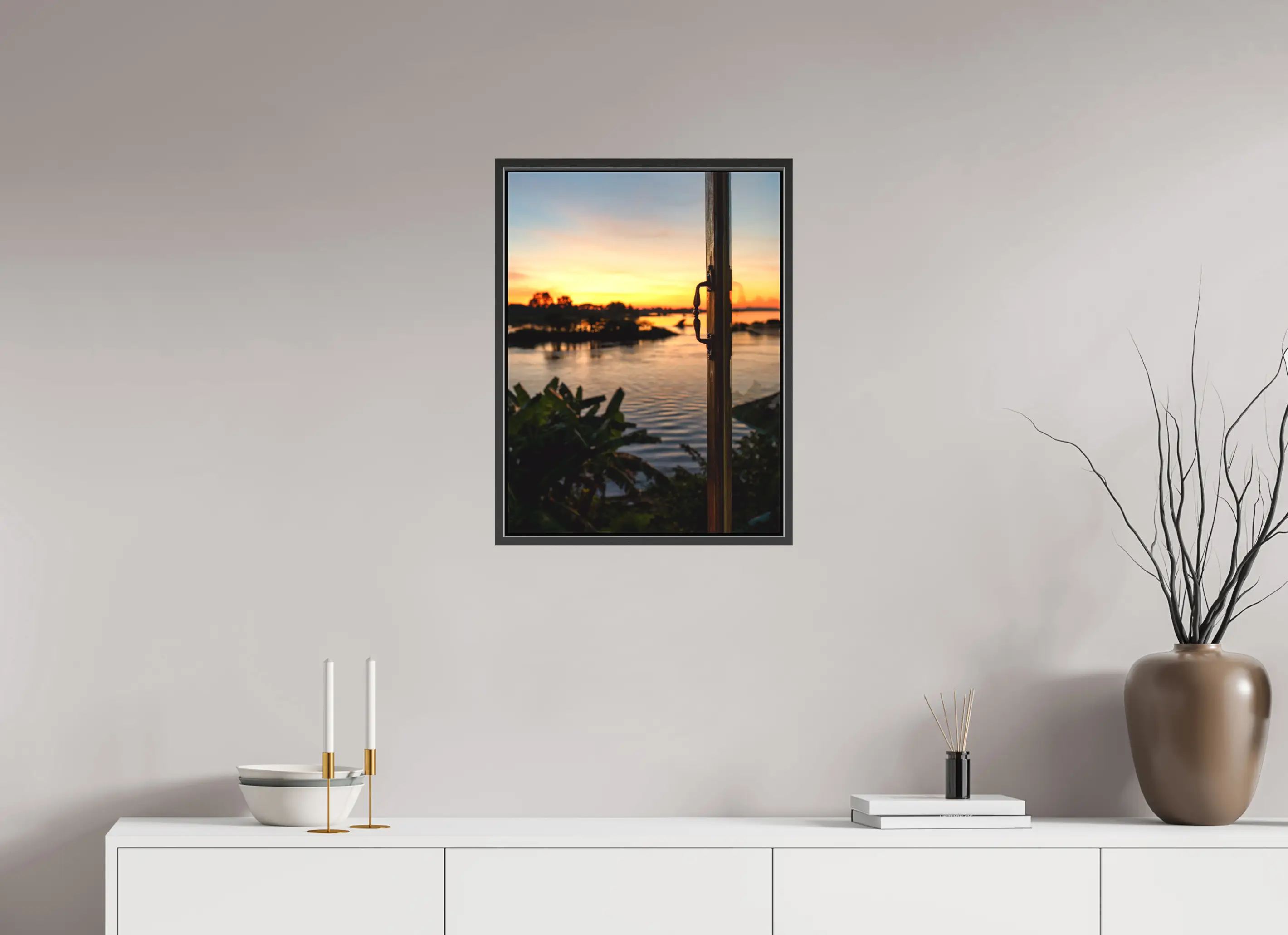 Fine art print “Twilight” featuring sunset over the Mekong River with warm orange and gold hues, displayed on a premium framed canvas print in a modern living room setting.