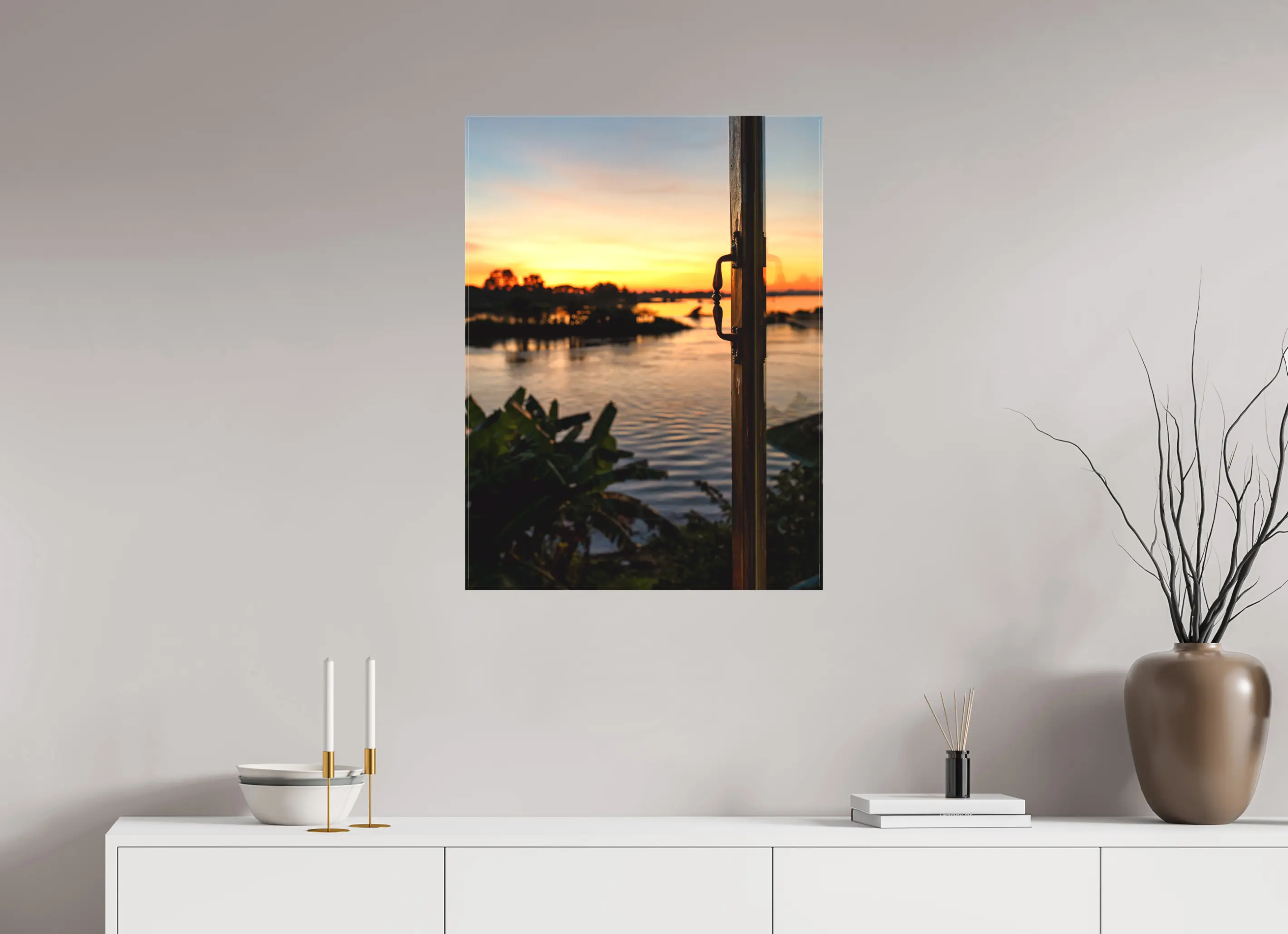 Fine art print “Twilight” featuring sunset over the Mekong River with warm orange and gold hues, displayed on a premium canvas print in a modern living room setting.
