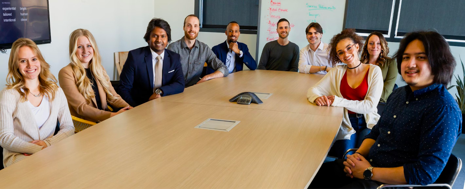 Global talent acquisition results: a diverse team sitting in the meeting room