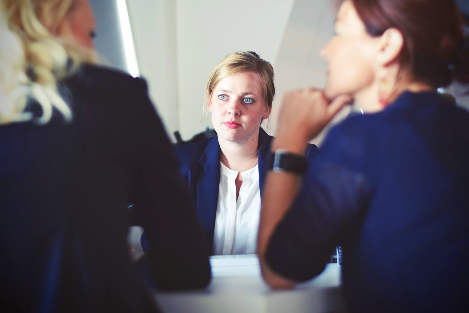 three women talking about employer of record contract