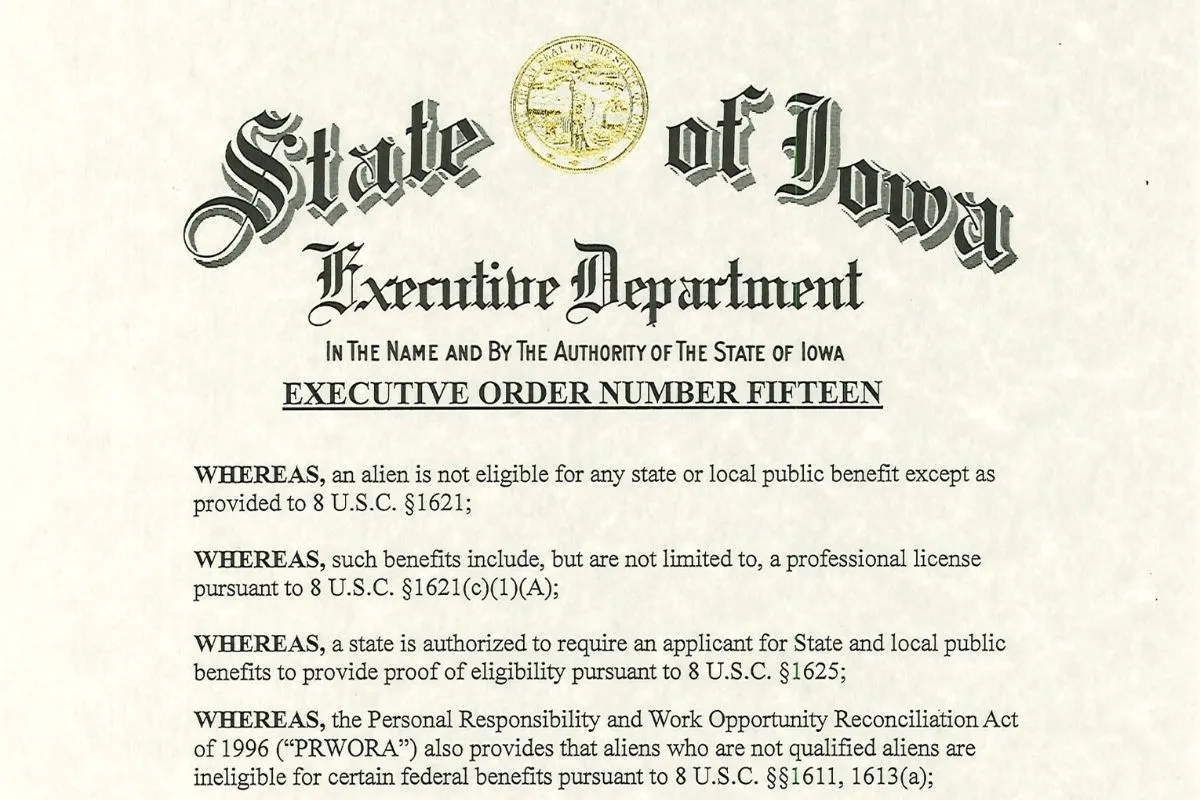 A scanned official document titled "Executive Order Number Fifteen" from the State of Iowa Executive Department. The text references federal statutes related to public benefits eligibility for non-citizens, including 8 U.S.C. §1621, §1625, and the Personal