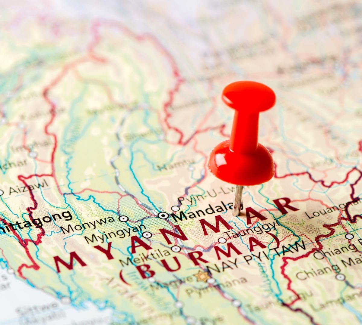 Map of Burma (Myanmar) marked with a red pin, highlighting the geographic context of DHS's TPS termination decision effective January 2026.