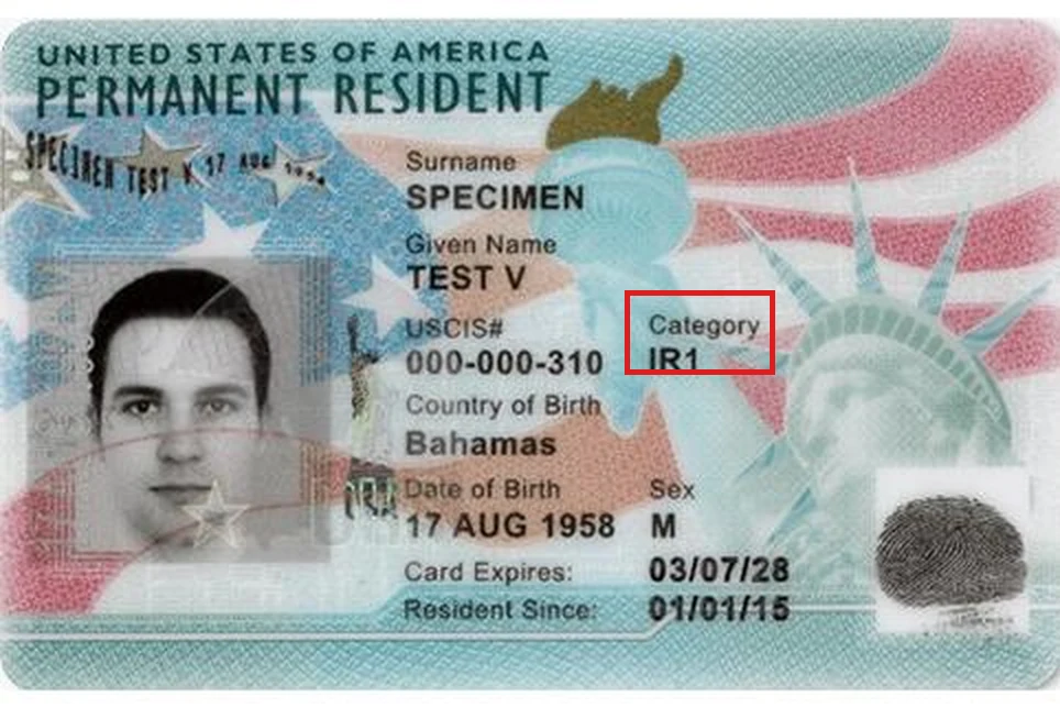 Front of a previous-design Permanent Resident Card (Form I-551) USCIS specimen with the Category field highlighted in a red box, showing immigrant class IR1.