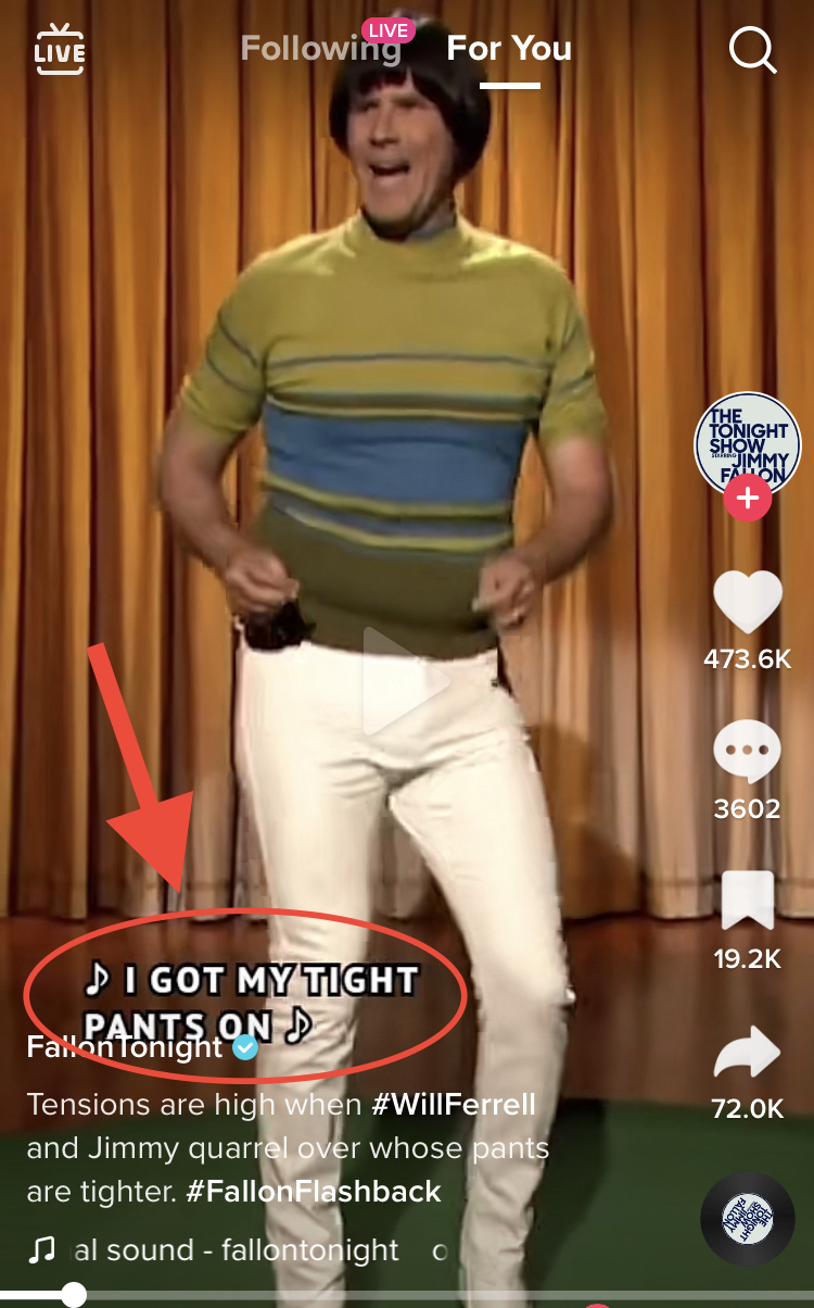 Screen shot of a TikTok from Fallon Tonight. Will Ferrell wears tight white pants and a green and blue striped turtleneck sweater as he sings and dances. On the bottom left, open captions are circled in red with a red arrow pointing to them.