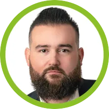A man with a beard in a green circle
