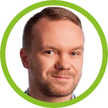 A headshot of a man with a green circle around him