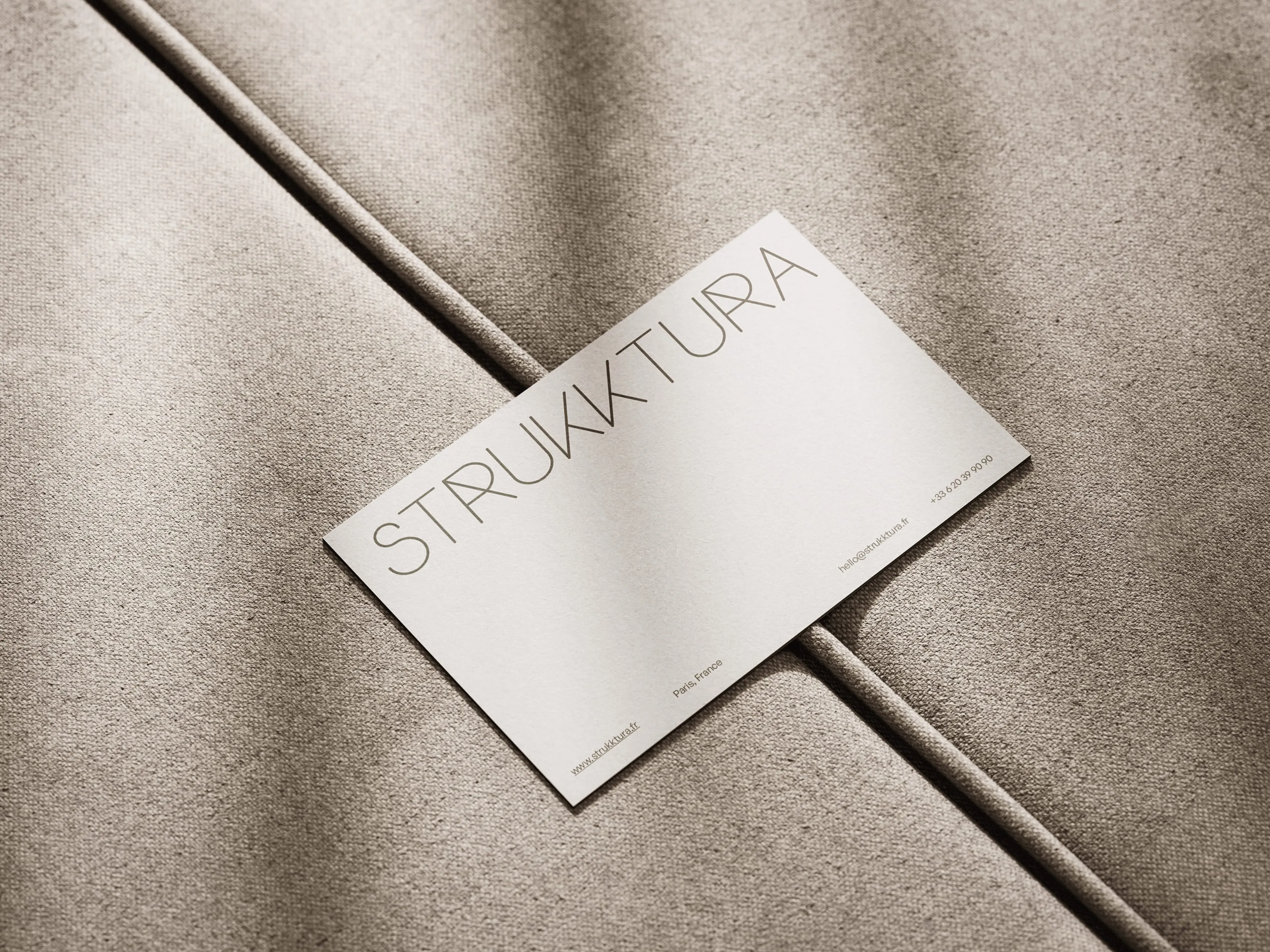 Business card with a modern design and contact information