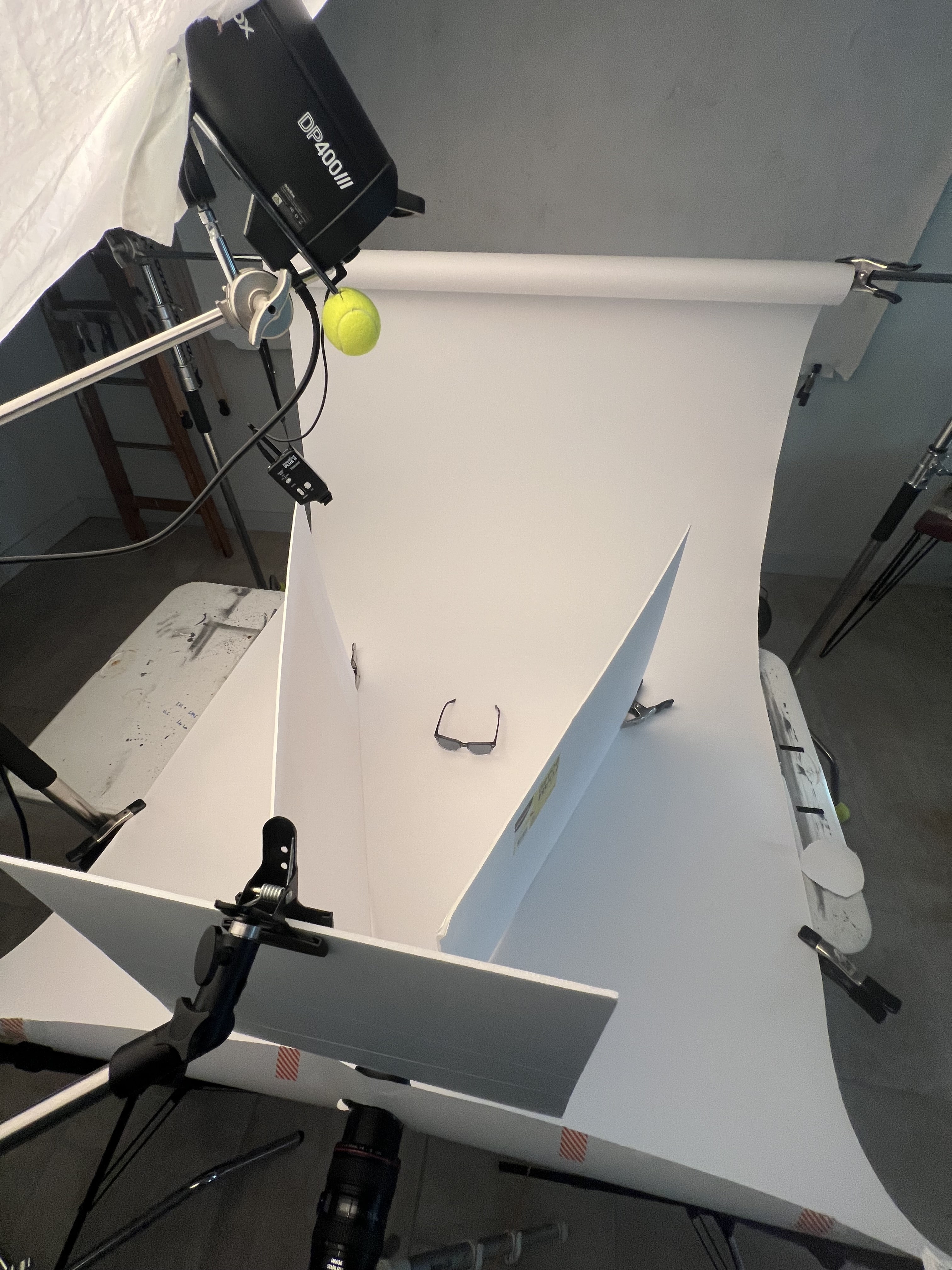 White foam board being used as a simple bounce to fill in shadow for a product shoot of sunglasses. Shot at BLNK Studios.