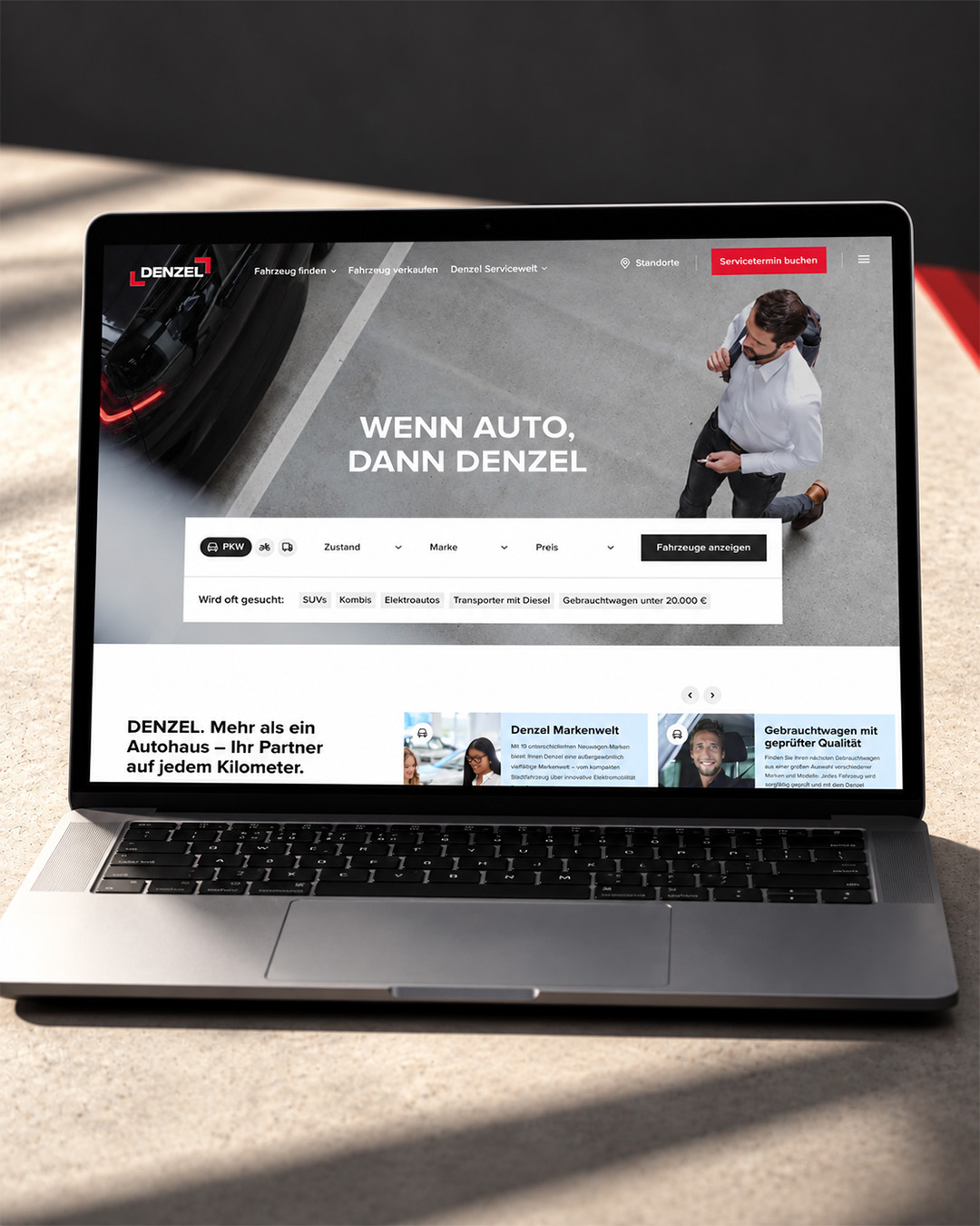 Startseite von denzel.at mit der Headline „Wenn Auto, dann DENZEL“ und der Schnellsuche für Fahrzeuge, dargestellt auf dunklem Hintergrund.