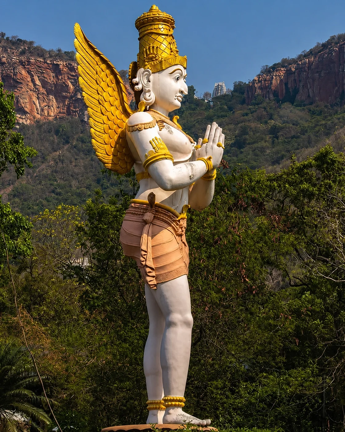 Garuda, the divine vahana of Sri Venkateswara Swamy, offering namaskaram before the Sapta Giri hills