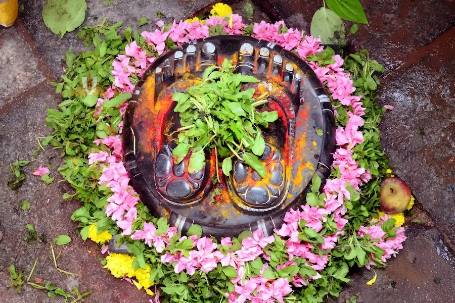 Garuda, the divine vahana of Sri Venkateswara Swamy, offering namaskaram before the Sapta Giri hills