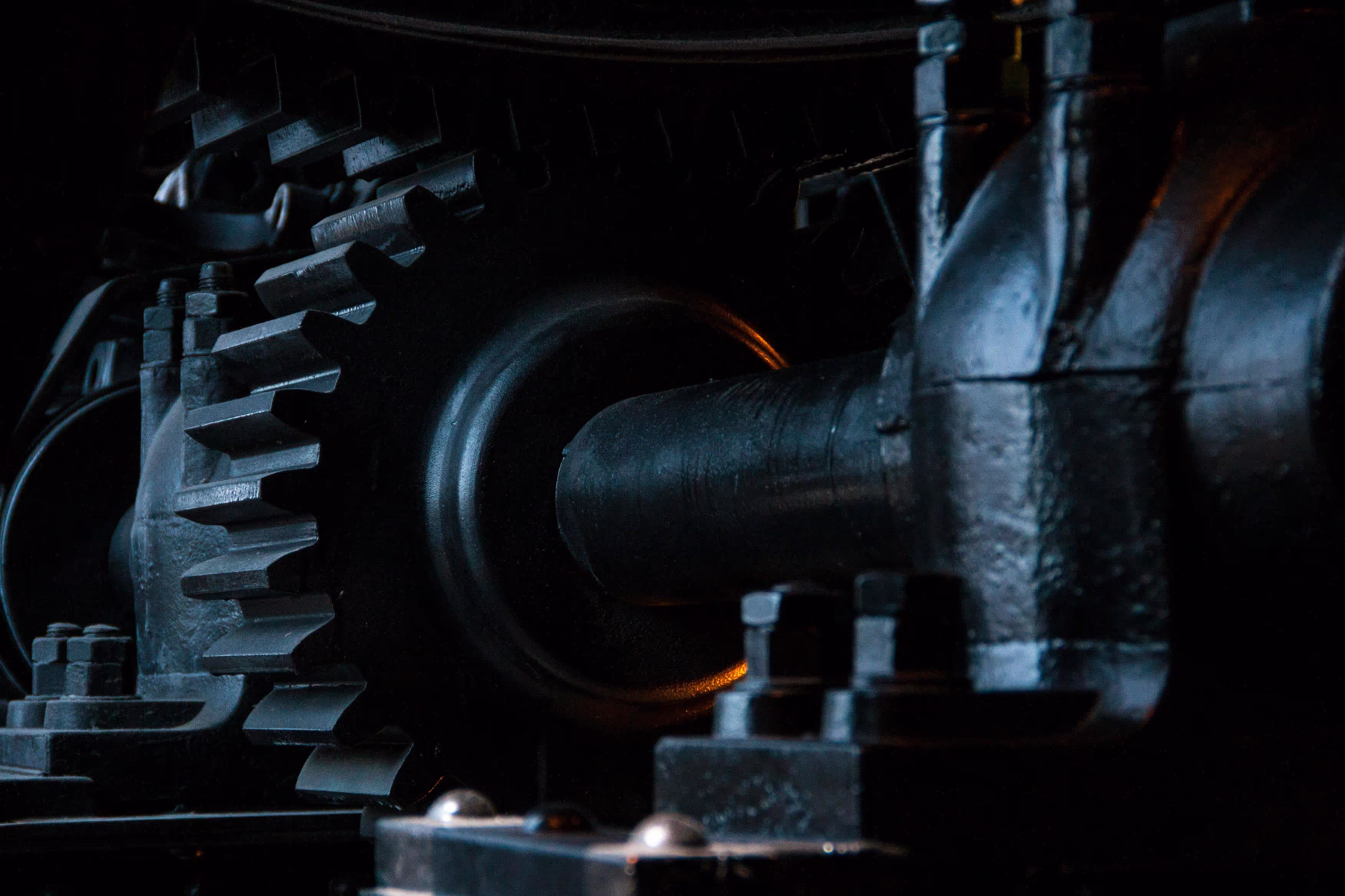 Internal view of heavy gears in a mechanical system.