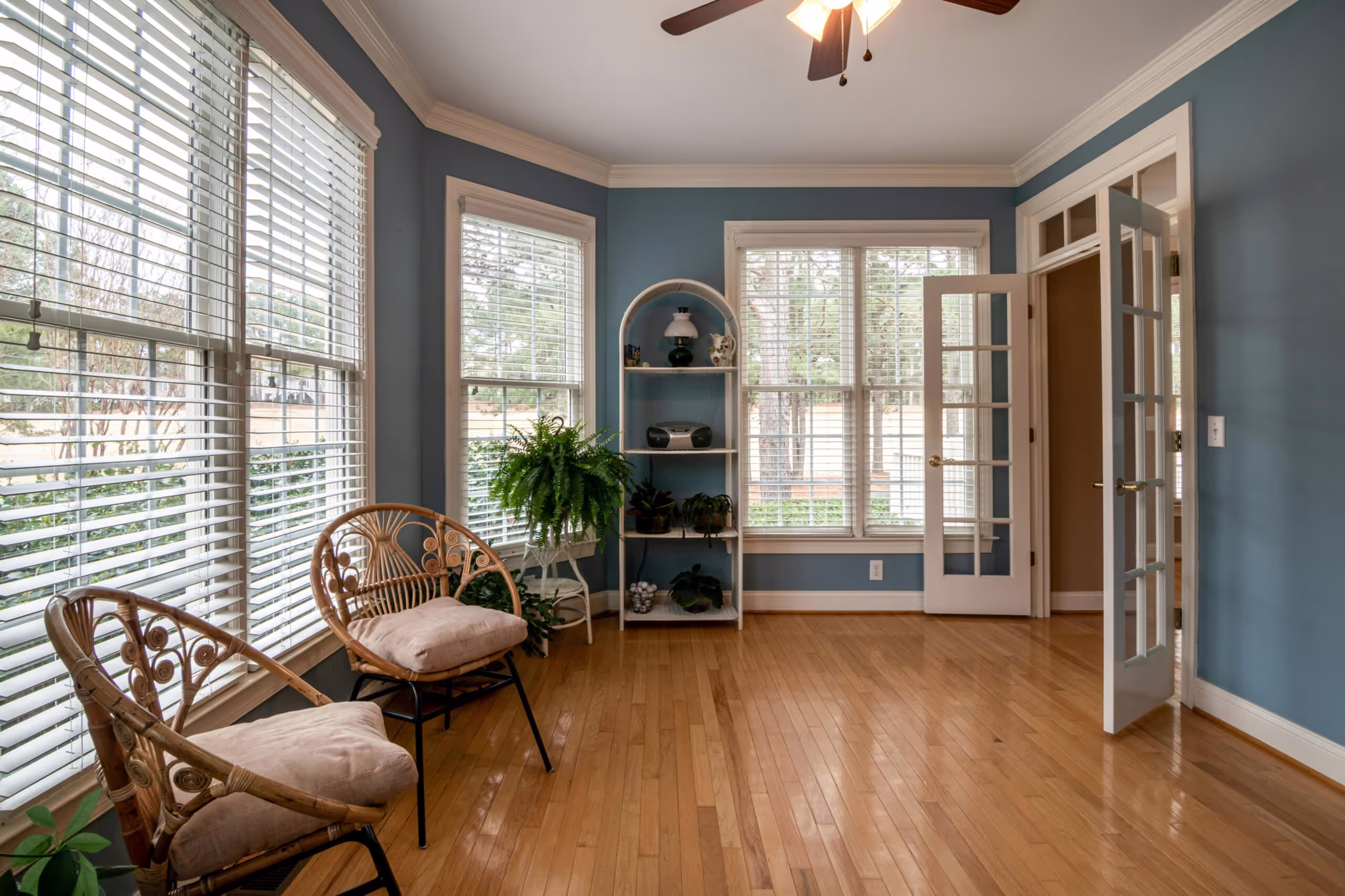 Bright sunroom with large energy-efficient replacement windows installed by Homezone Windows and Roofing in Michigan