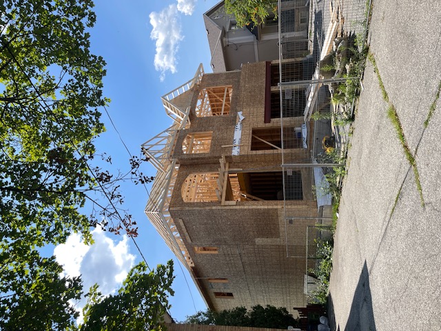 New home construction in Toronto showing fully installed roof trusses during framing stage