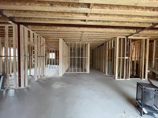 Full basement framing completed in new custom home construction in Toronto, Ontario, showing structural wood framing across entire lower level