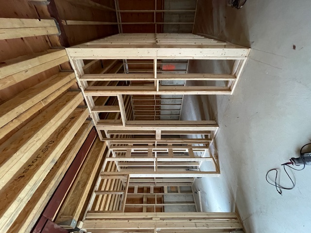 Framed basement with two interior door openings in new custom home build in Toronto, Ontario