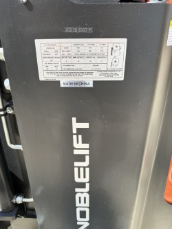Close-up of Noblelift PS35TSL-169 Straddle-Leg Walkie Electric Stacker specification label showing 3,500 lb capacity, 24V 270AH battery, and 169-inch lift height