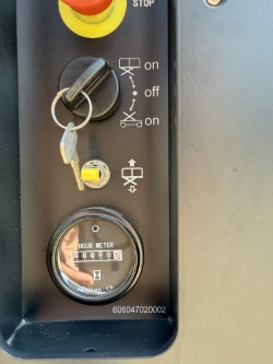 Close-up of Noblelift SC1930EC scissor lift ignition switch and hour meter for equipment usage tracking