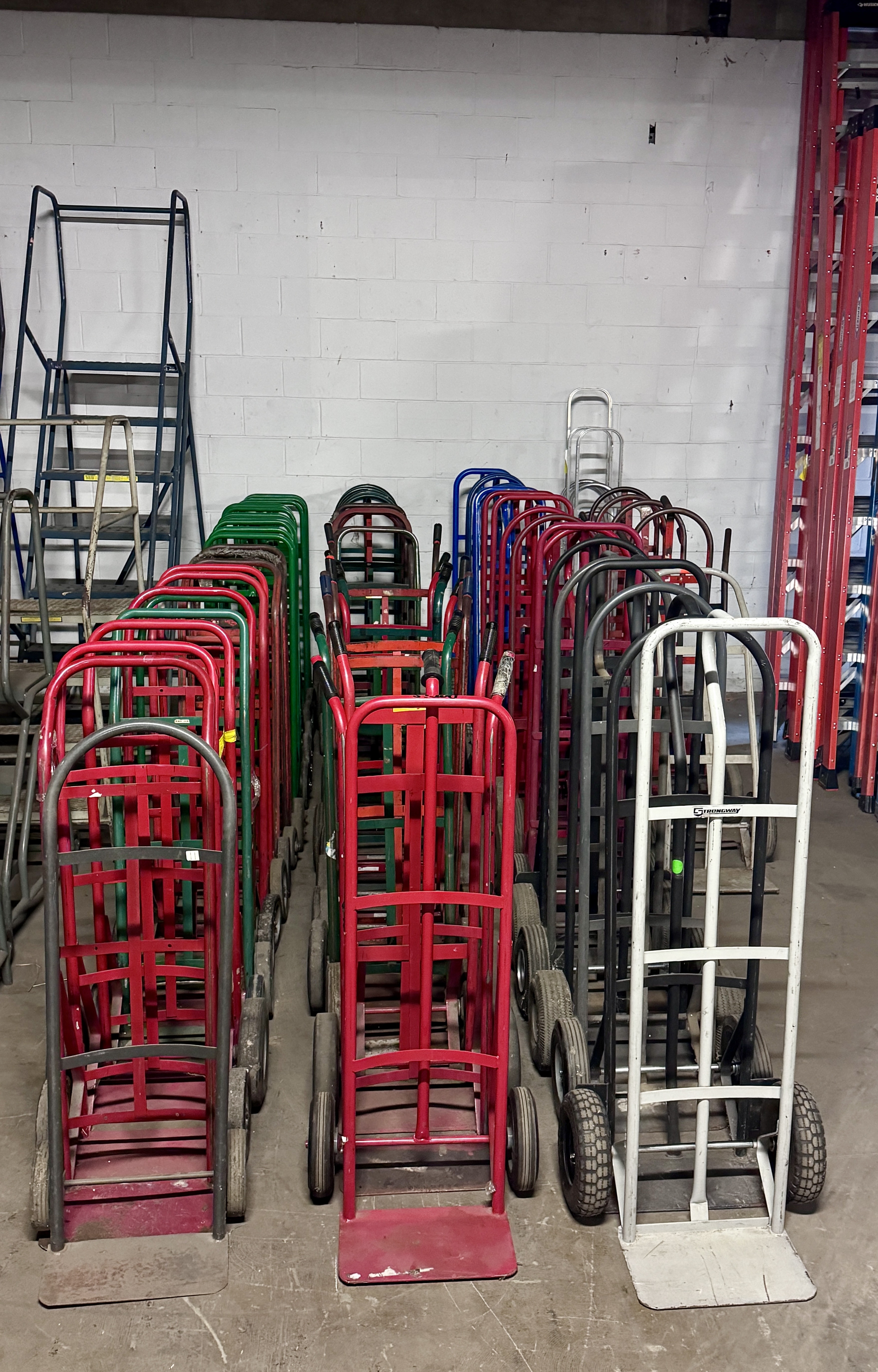 Large selection of commercial hand trucks and dollies in multiple colors, ideal for warehouse, retail backroom, and material handling operations. Hand trucks available from Mid-America Store Fixtures.