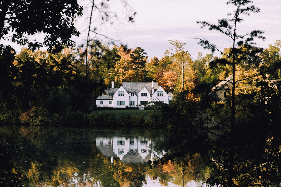 House positioned near a river at risk from flooding.