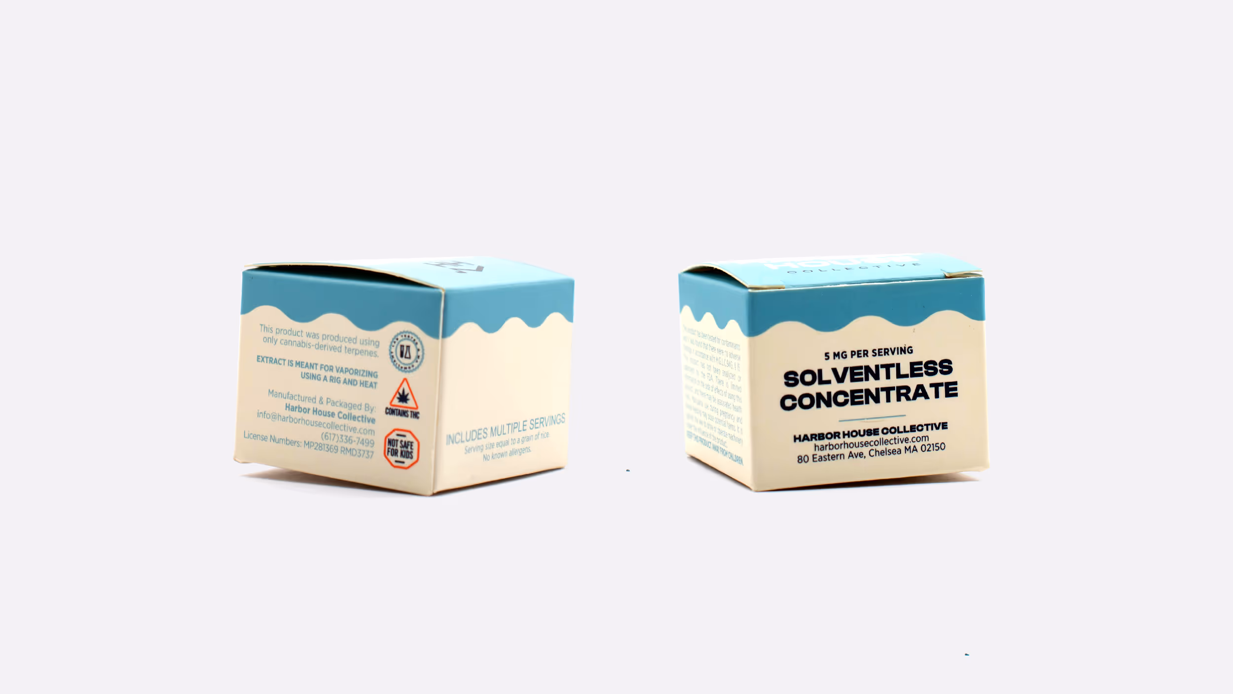 Two small boxes of solventless cannabis concentrate with blue tops and beige bottoms, labeled with product and safety information.